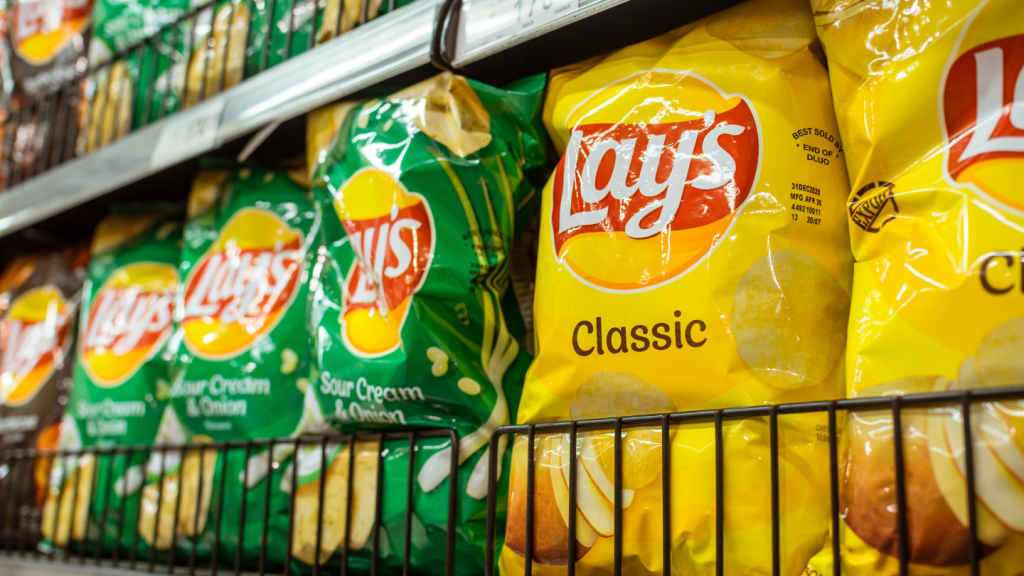 Lay's potato chips on display at an aisle in a supermarket.